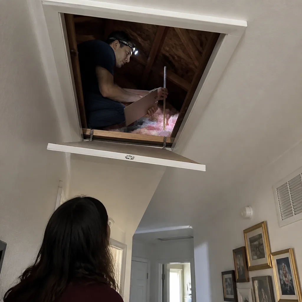 Technician performing a residential blower door energy audit with testing equipment nationwide